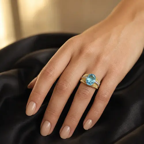 Anel Aramado de Ouro com Topázio Sky Blue e 4 Diamantes