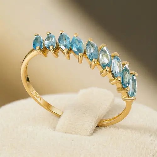 Meia Aliança de Ouro com 1,0 Ct em Topázios London Blue navetes