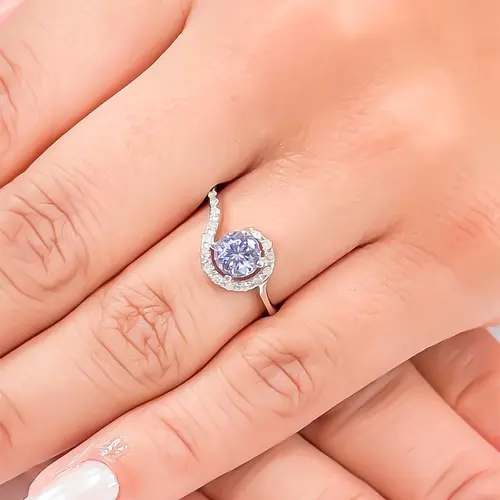 Anel Caracol de Ouro Branco com 18 Diamantes e Tanzanita de 1,05 cts.