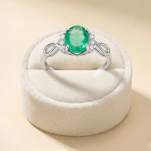 Anel Infinito de Ouro Branco com Diamantes e Esmeralda de 80 pts.