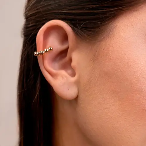Pircing Trabalhado Meia Esfera em Ouro Amarelo.