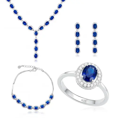 Conjunto Par de Brincos, Gargantilha e Pulseira e Anel de Prata com Cristais e Safiras Totalizando 55,0 Cts.