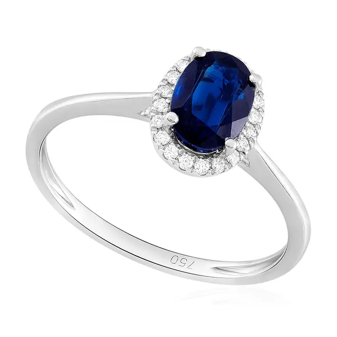 Anel de Ouro Branco com Diamantes e Safira totalizando 1,05 Cts.