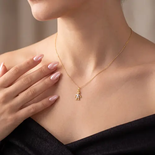 Pingente Menino com bola em Ouro Amarelo 18k com detalhe em ródio